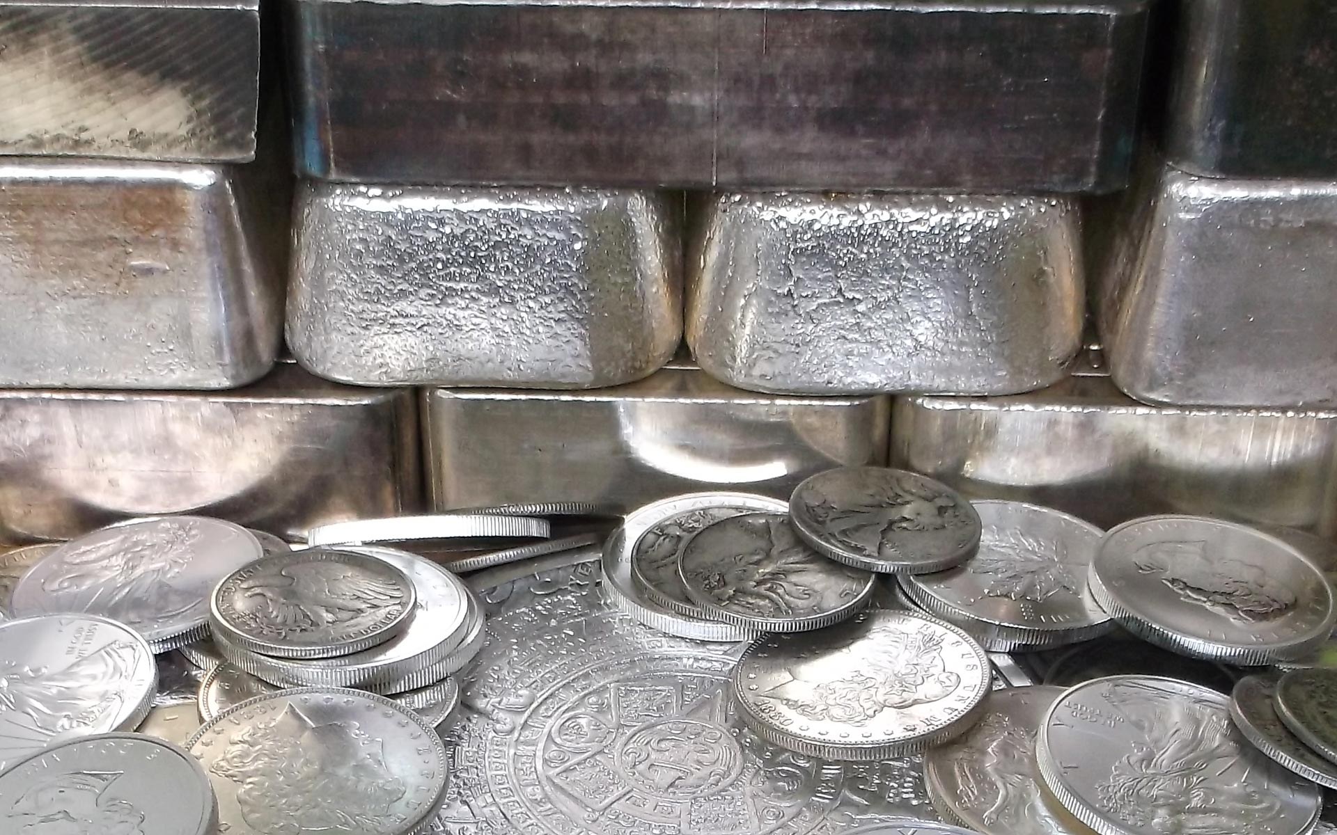 Silver bullion bars and coins